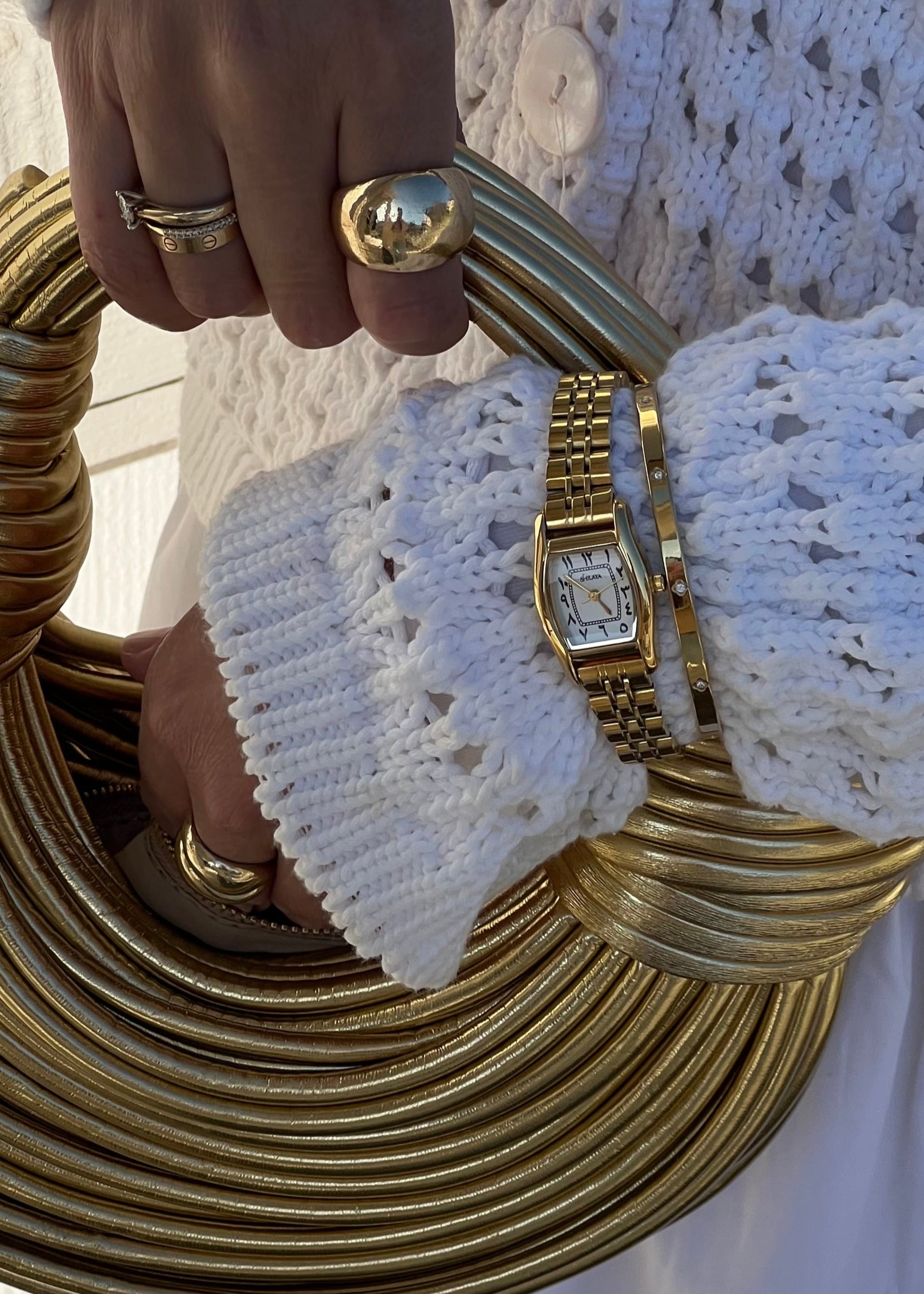 THE CLASSIC GOLD WATCH WITH ARABIC NUMERALS