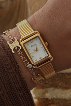 THE CLASSIC GOLD WATCH WITH ARABIC NUMERALS