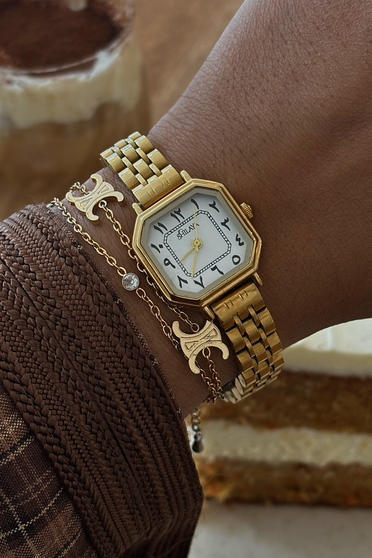 THE MIDNIGHT GOLD WATCH WITH ARABIC NUMERALS
