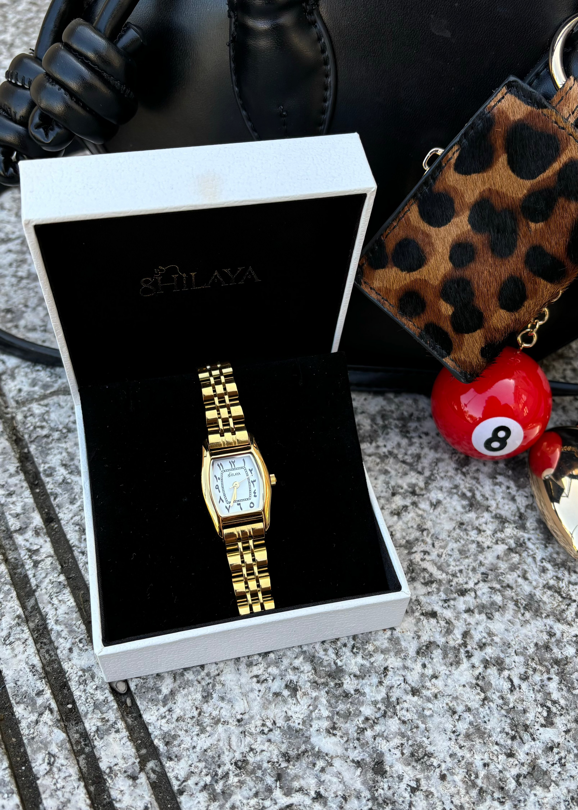 THE CLASSIC GOLD WATCH WITH ARABIC NUMERALS