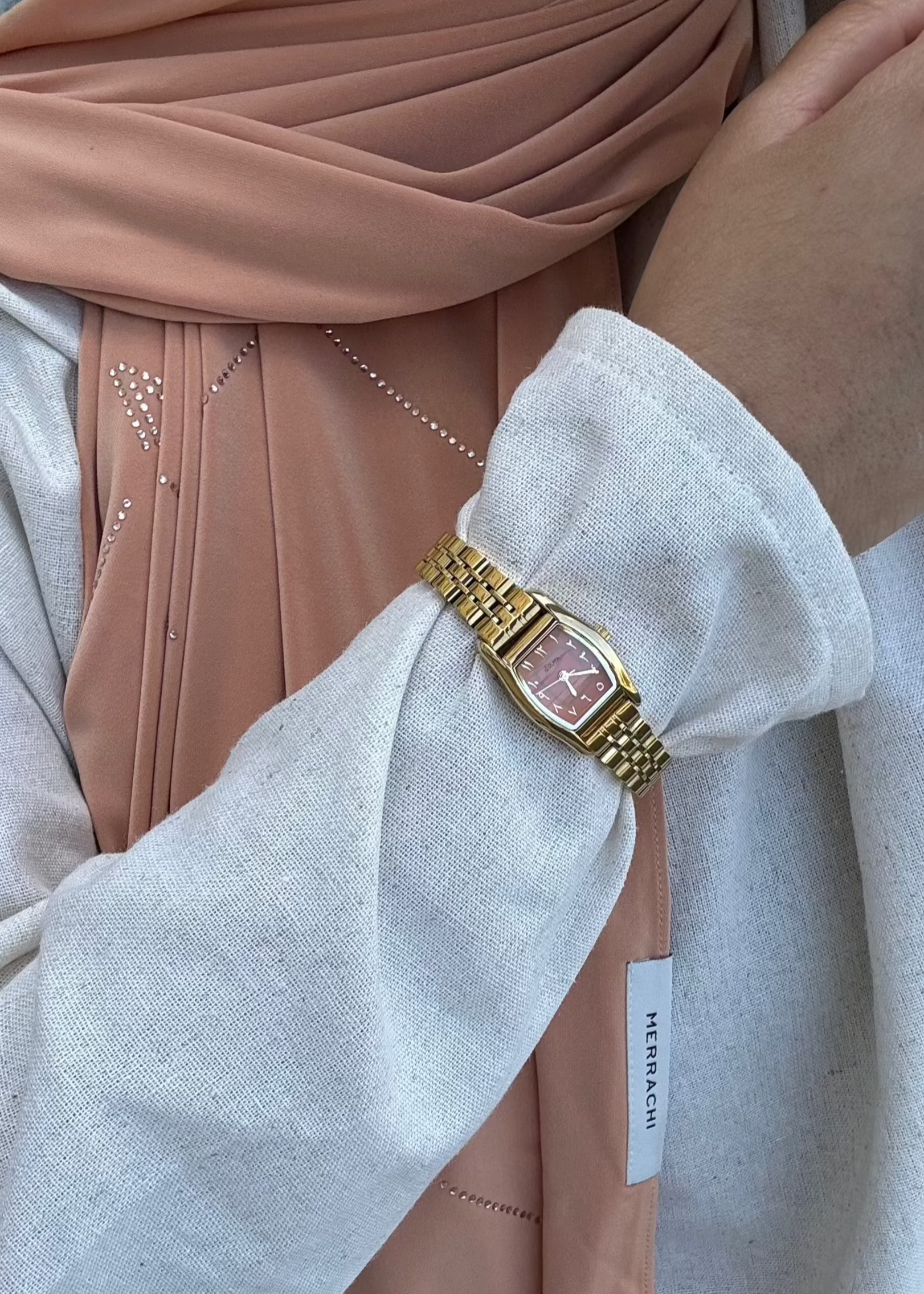 THE CLASSIC GOLD WATCH WITH ARABIC NUMERALS