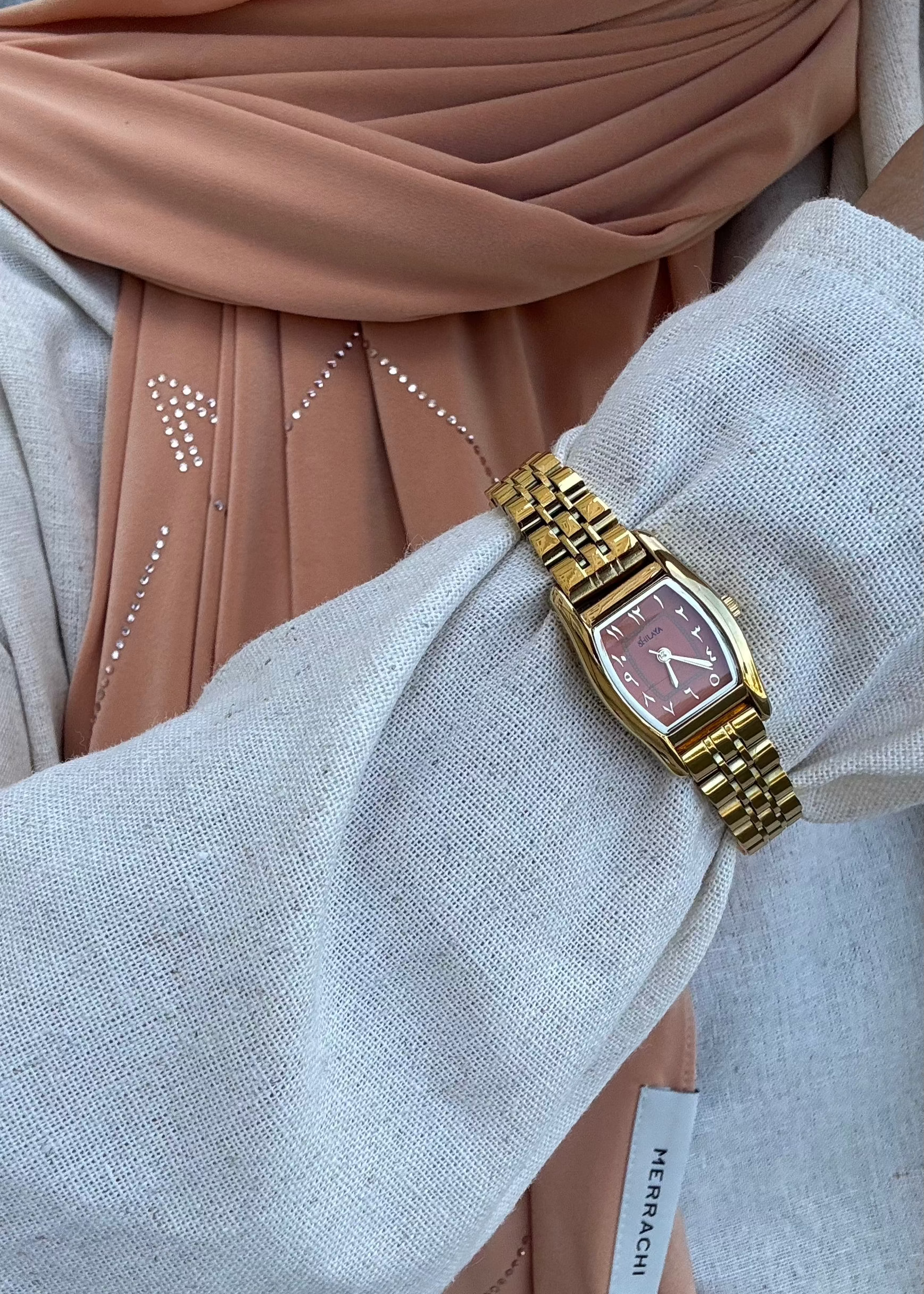 THE CLASSIC GOLD WATCH WITH ARABIC NUMERALS
