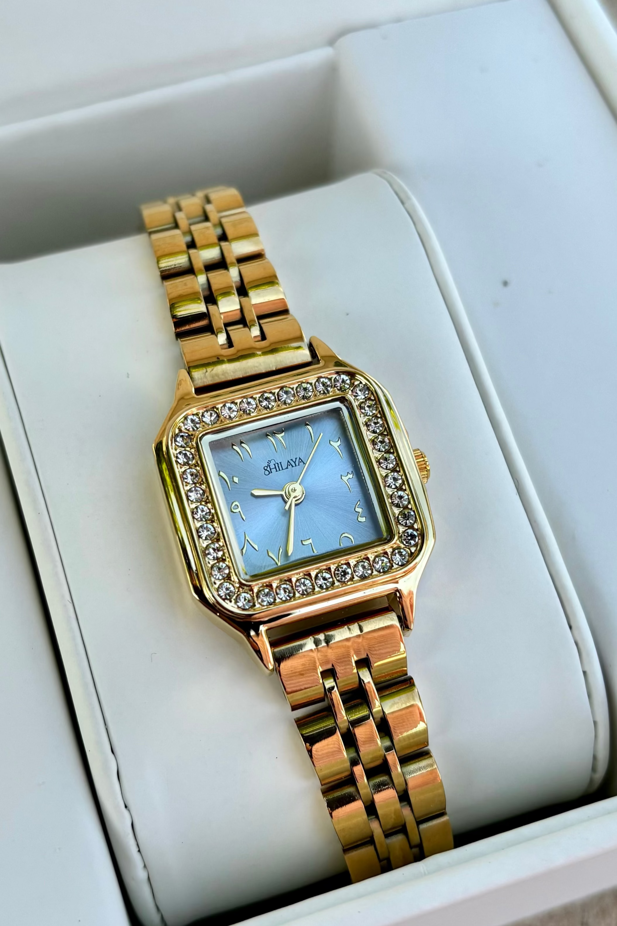 THE MIDNIGHT GOLD WATCH WITH ARABIC NUMERALS