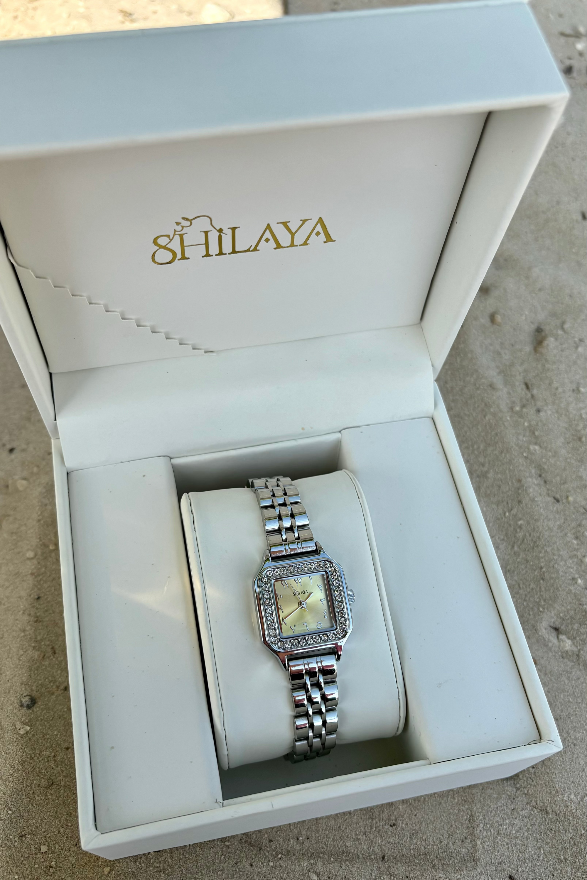THE MIDNIGHT GOLD WATCH WITH ARABIC NUMERALS