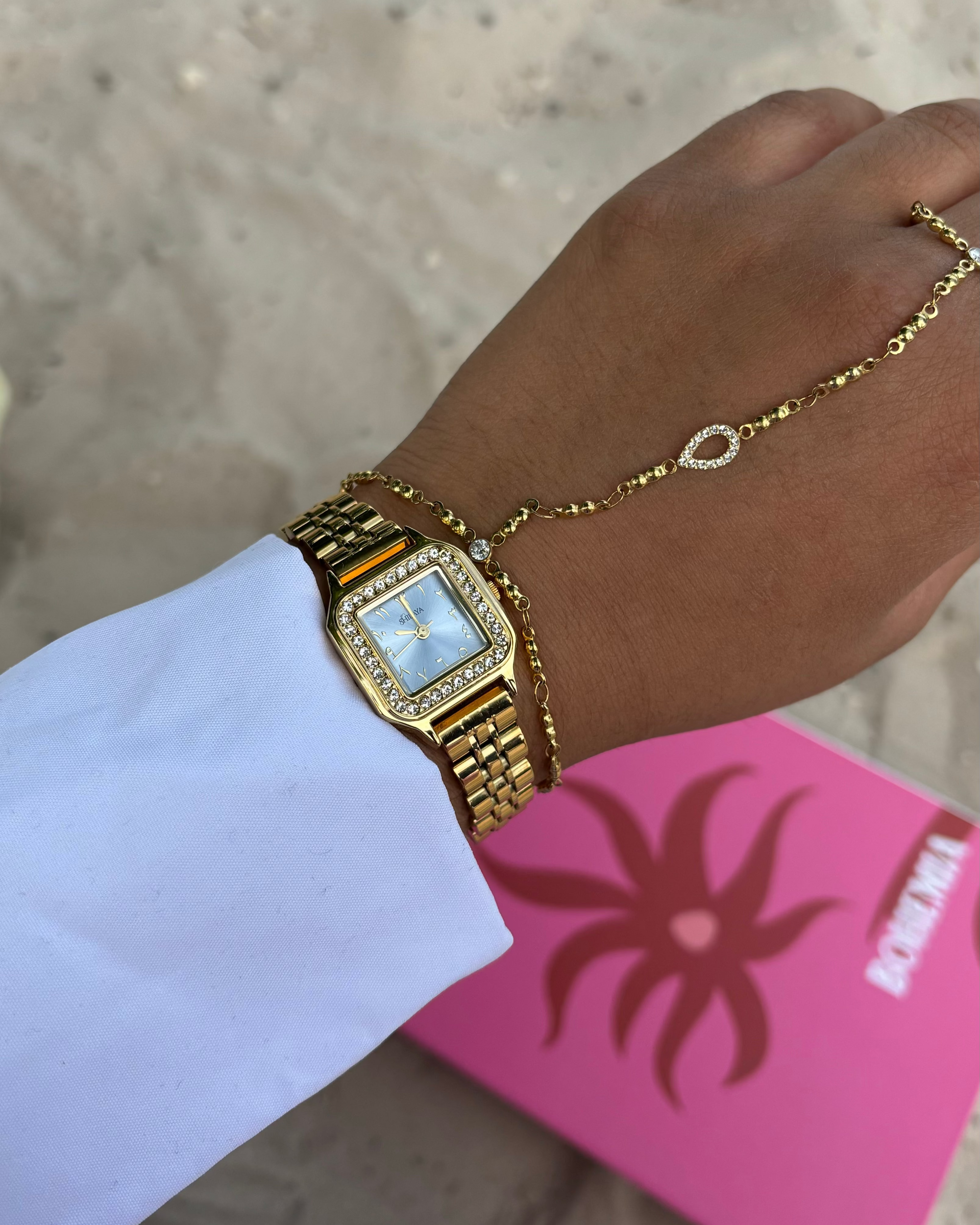 THE MIDNIGHT GOLD WATCH WITH ARABIC NUMERALS