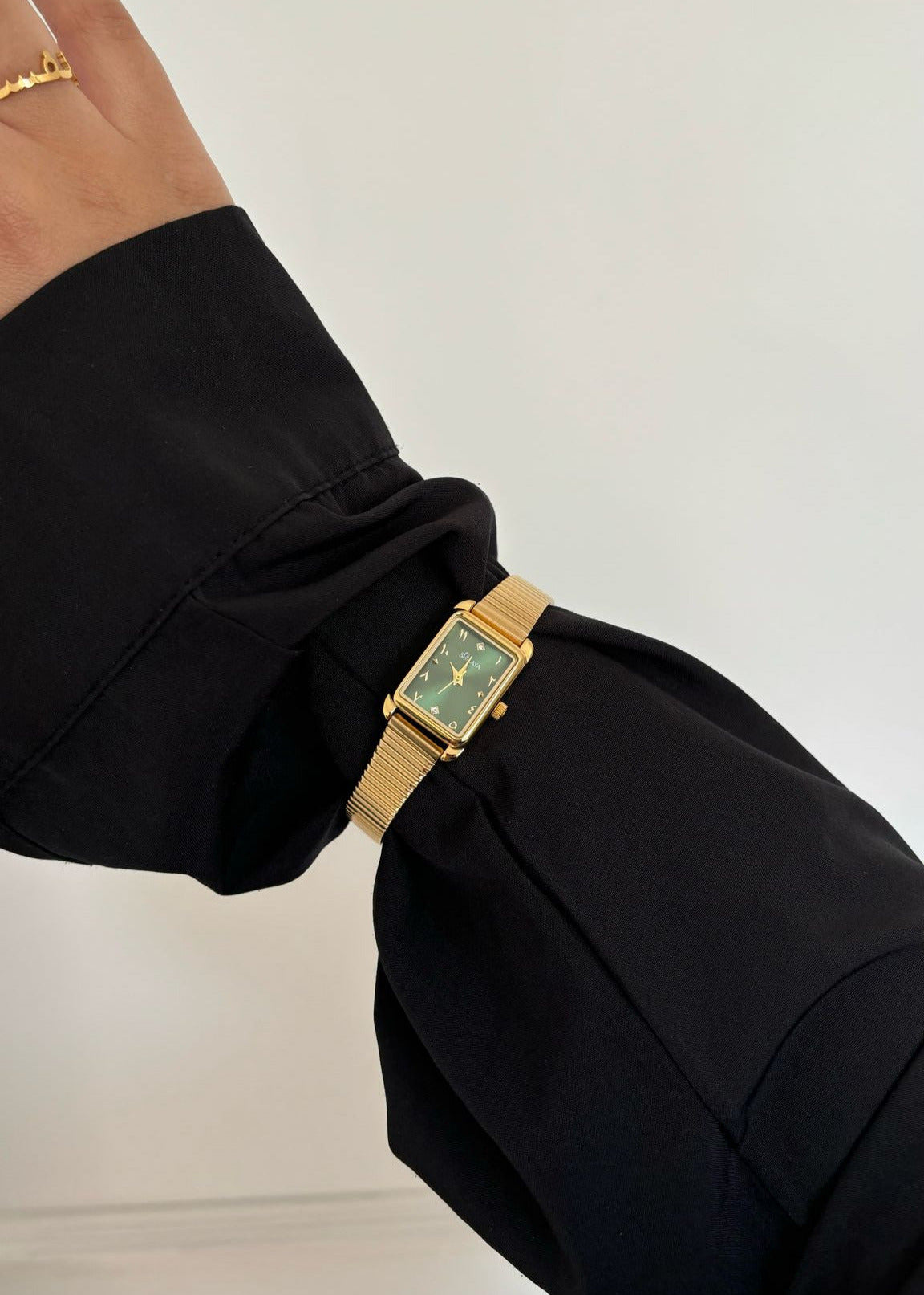 THE MIDNIGHT GOLD WATCH WITH ARABIC NUMERALS