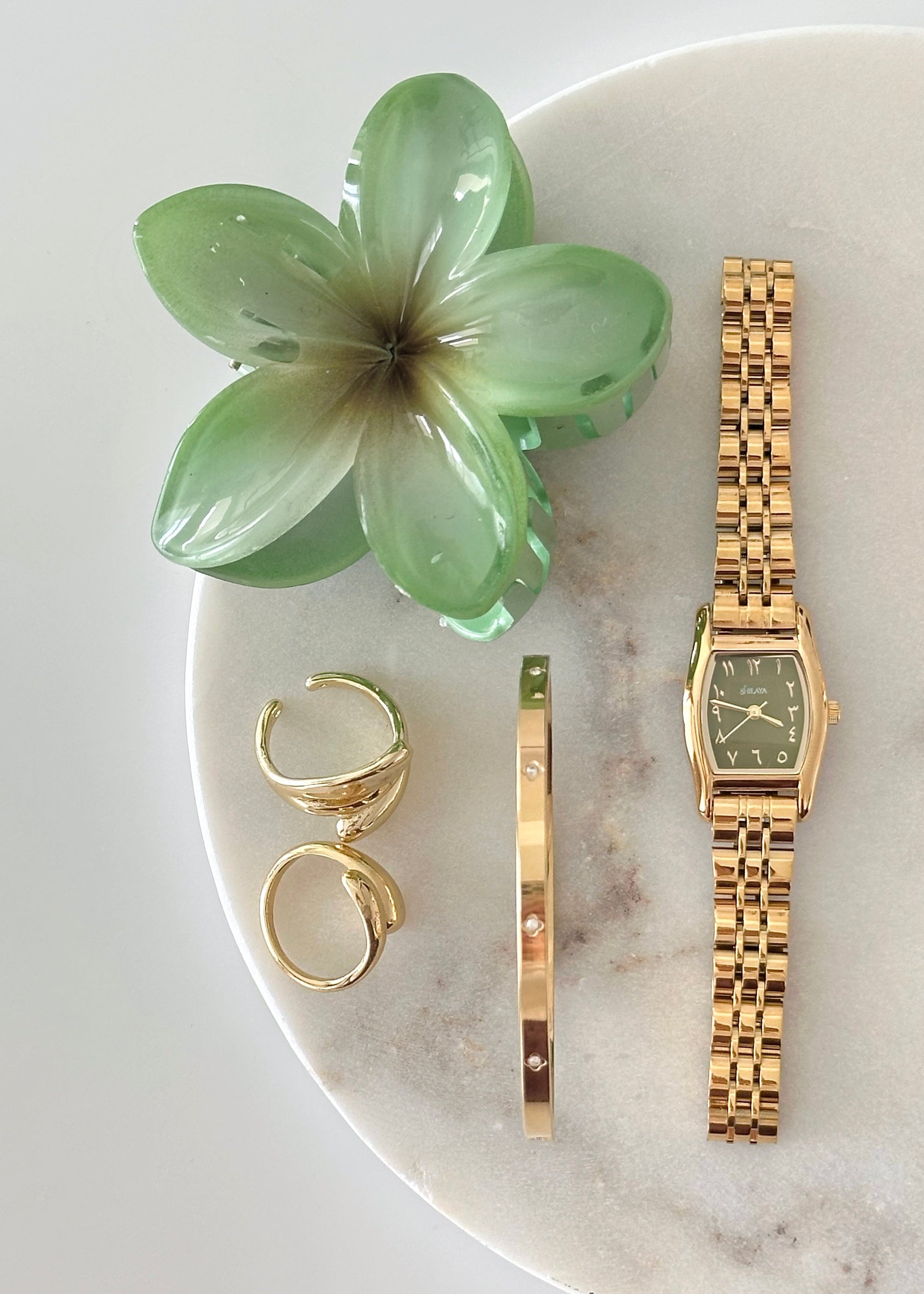 THE CLASSIC GOLD WATCH WITH ARABIC NUMERALS