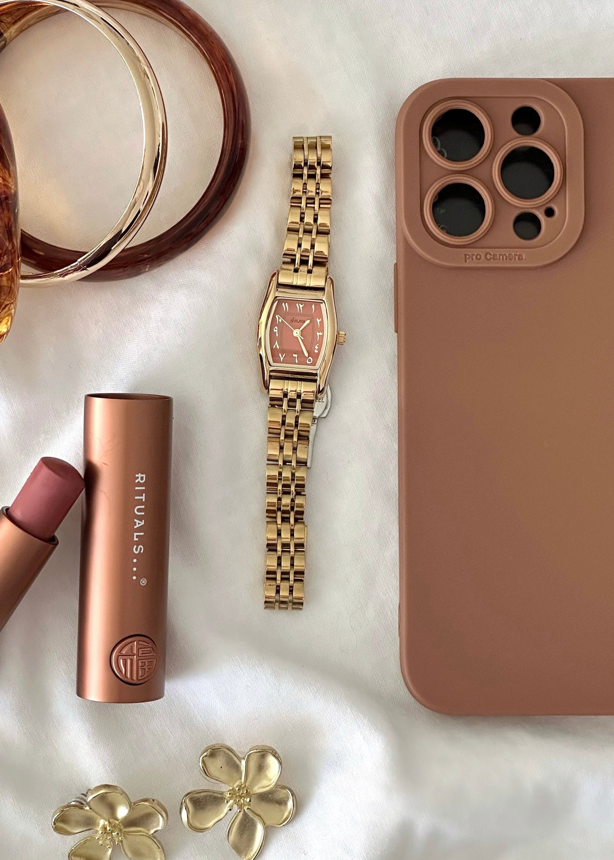 THE CLASSIC GOLD WATCH WITH ARABIC NUMERALS
